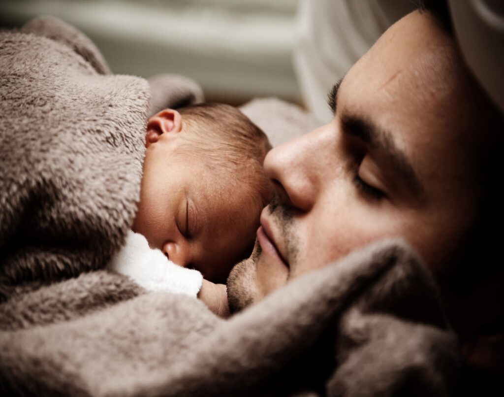 baby sleeps dad: life insurance protects the ones we love